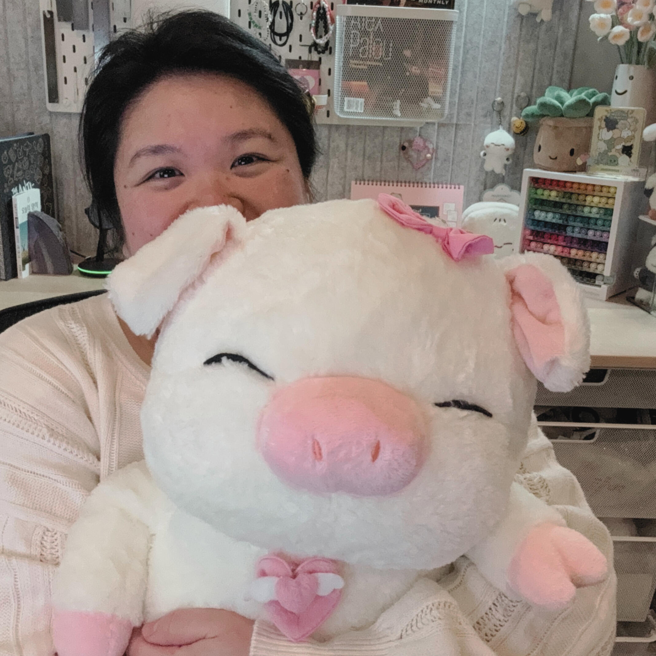 A photo of My stuffed animal, samsook, and me.